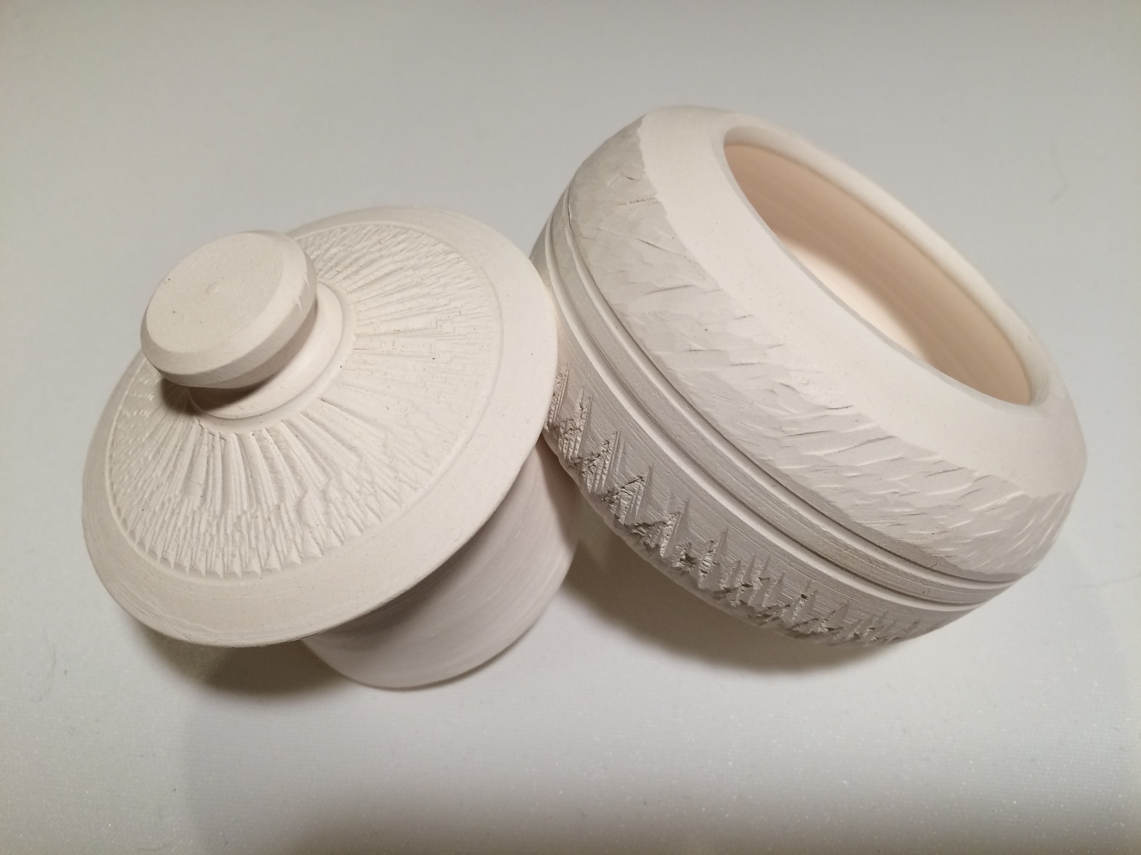 Textured French butter dish 1 with textured lid by the side, unglazed, porcelain